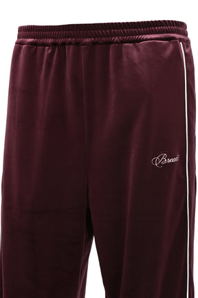 SCRIPT LOGO PIPING VELOR TRACK PANTS / BUR