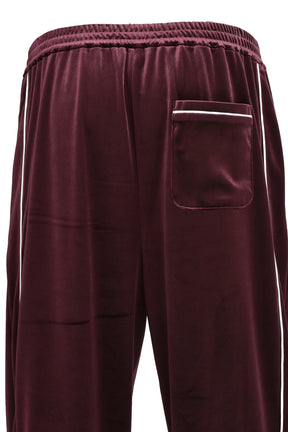 SCRIPT LOGO PIPING VELOR TRACK PANTS / BUR